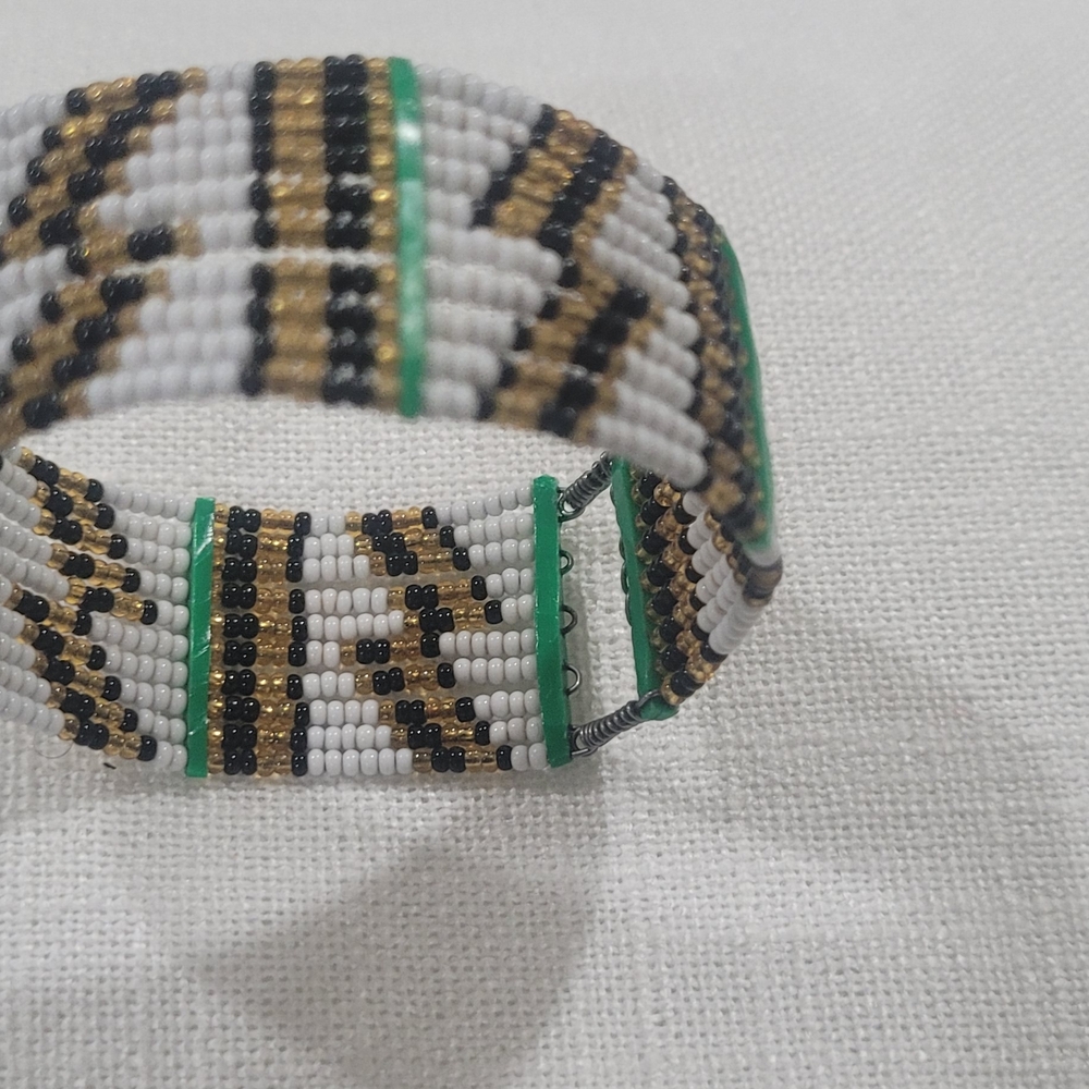 Elegant Beaded Bracelet with Gold, Black, and White Accents